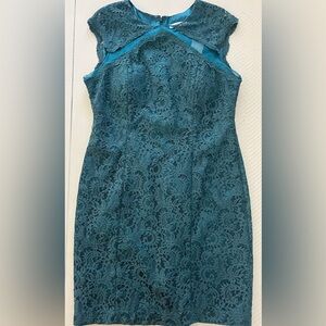 Piperlime teal cap-sleeve lace dress with mesh accents . Dress is fully lined.